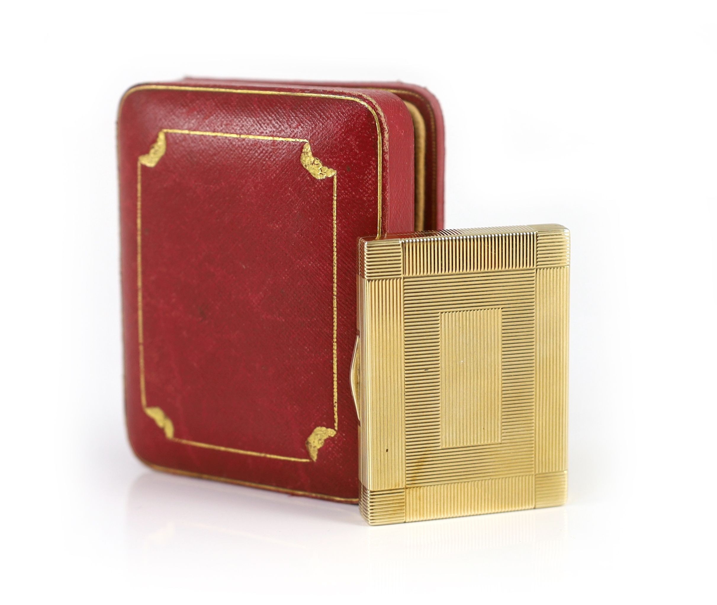 A 1930's Cartier 9ct gold compact, with diamond set thumbpiece